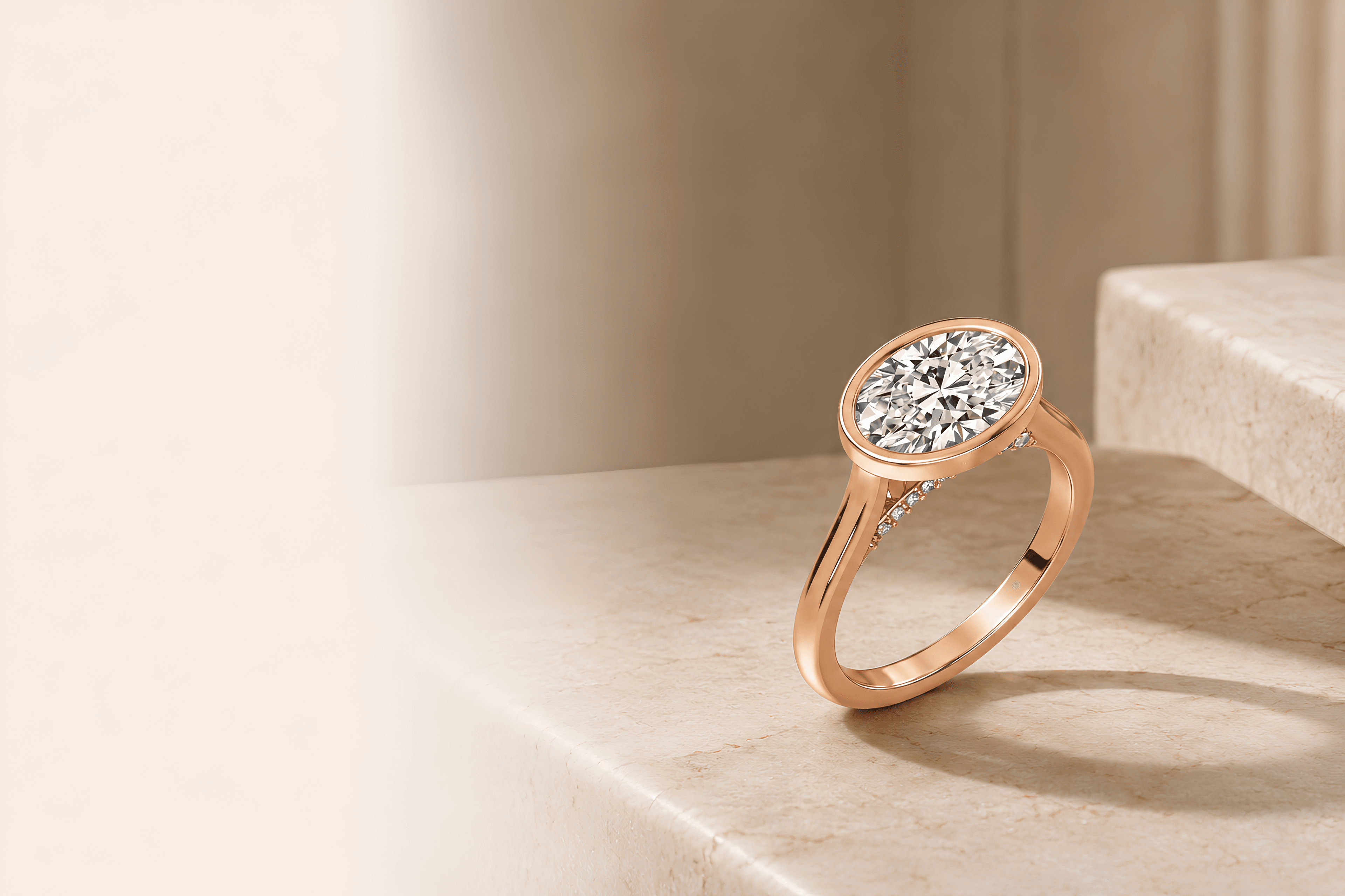 Oval bezel pavé engagement ring on travertine
